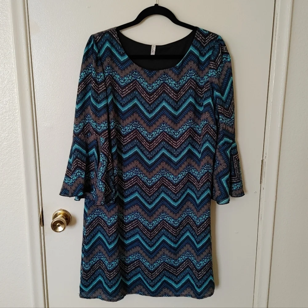 Celeste knee-length dress with blue/teal/black pattern and flowy sleeves - Picture 1 of 4